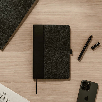 Vinga Albon GRS recycled felt A5 notebook with integrated pen holder and mélange exterior, ideal for portable note-taking.