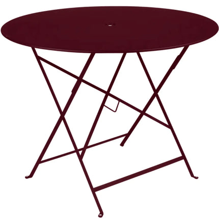 Deep orange Fermob Bistro Round Table with metal top and parasol hole
