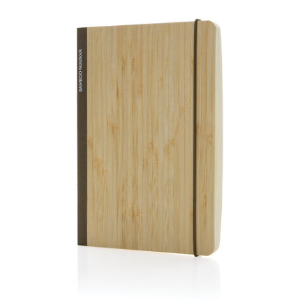 Set of 25 black A5 bamboo notebooks by Custom Wood Designs, featuring eco-friendly cover and compact writing pages.