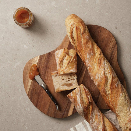 Set of 25 large Acacia wood serving and cutting boards with angled edges, from Custom Wood Designs, FSC Certified.