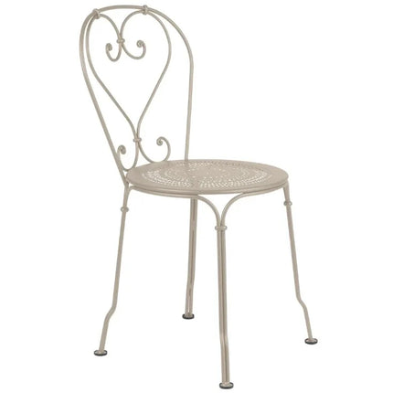  featuring a slatted seat and curved armrests for outdoor seating.