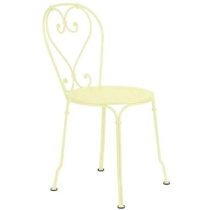 Fermob 1900 outdoor chair with a sleek metal frame and colorful woven seat