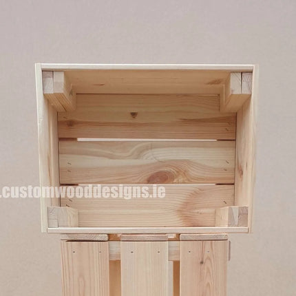 Small pine wood crate by pin showing a rustic wooden storage crate with a natural finish and sturdy construction.