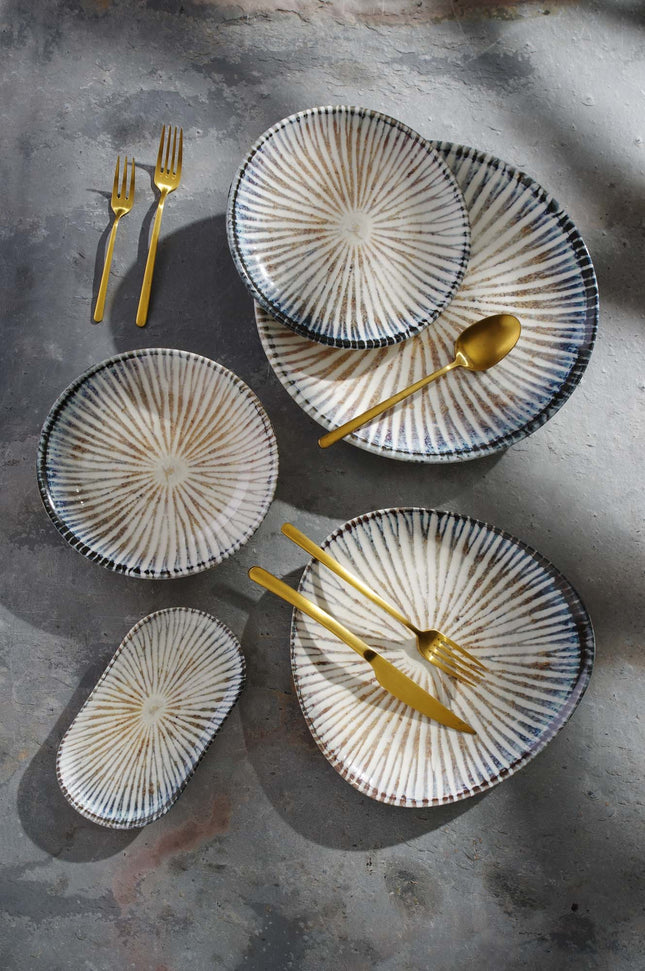 Oval Ammonite plate by Fine Dine, measuring 200 x 110 mm, featuring a smooth, polished surface and elegant design.