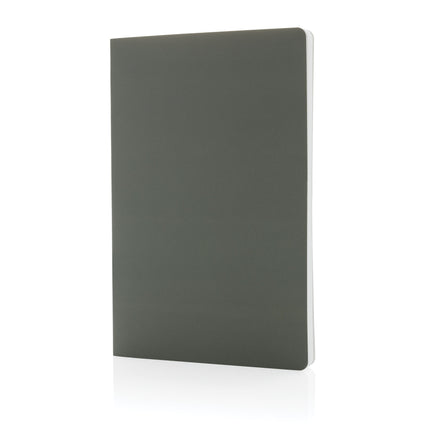 Pack of 25 navy A5 softcover notebooks with stone paper by Custom Wood Designs, showing the covers and binding.