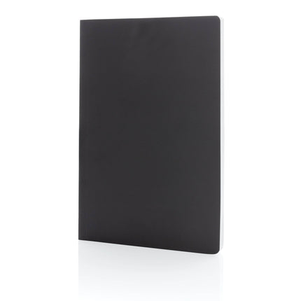 Set of 25 navy A5 softcover notebooks with stone paper, by Custom Wood Designs, showing the covers and binding.