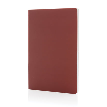 Pack of 25 navy A5 softcover stone paper notebooks by Custom Wood Designs, showcasing durable covers and eco-friendly pages.