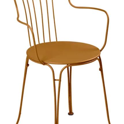 Candied orange Fermob OPÉRA+ outdoor metal armchair with curved armrests and slatted backrest for stylish outdoor seating.