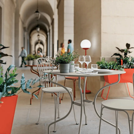 Fermob OPÉRA+ metal outdoor chair with curved backrest and armrests