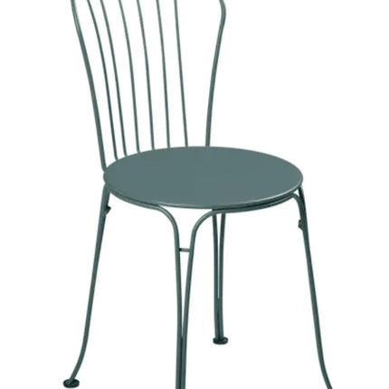 Fermob OPÉRA+ outdoor metal chair in Acapulco Blue with curved backrest and armrests