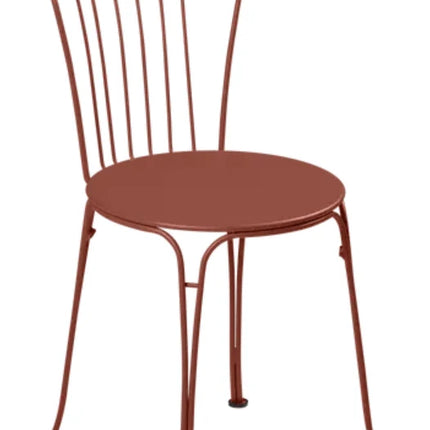Cedar green Fermob OPÉRA+ metal outdoor chair with curved backrest and armrests