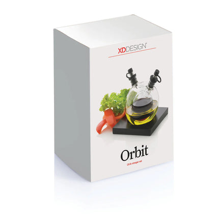 XD Design Orbit oil and vinegar set with clear glass bottles and black pour spouts for stylish kitchen storage.