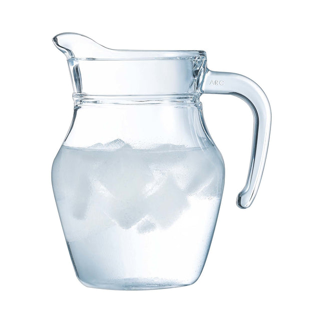 Arcoroc 500ml Arc jug with clear glass body and curved handle, ideal for serving beverages in a modern kitchen setting