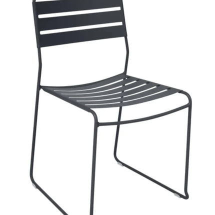 Fermob Surprising outdoor chair with curved metal frame and colorful woven seat